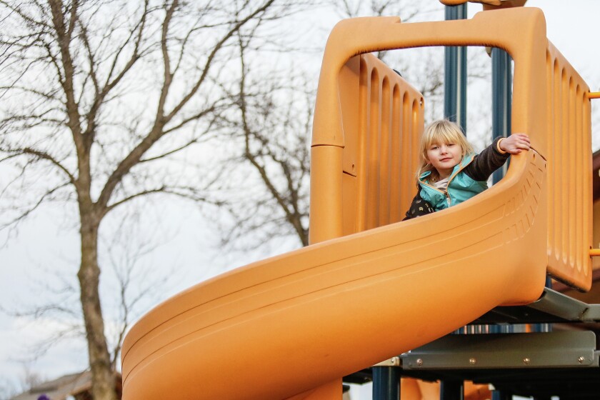 Four-year-old Aubrey Larson, left, plays at the playground in M.B. Johnson Park in north Moorhead on Tuesday, March 15, 2016. Rick Abbott / The Forum