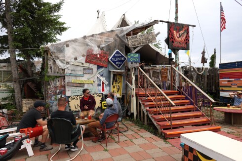 Customers enjoy drinks outside cafe