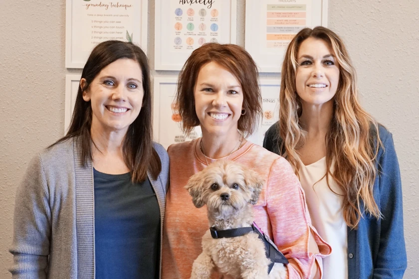 From left, School Director Chris Kragenbring, Social Emotional Learning Interventionist Kayla Hoelscher and MA LMFT Student Therapist Molly Swenson-Iserman. The dog's name is Maisey, Swenson-Isermsan's support dog in training that has become a familiar face at Kalon.Thalen Zimmerman / Alexandria Echo Press