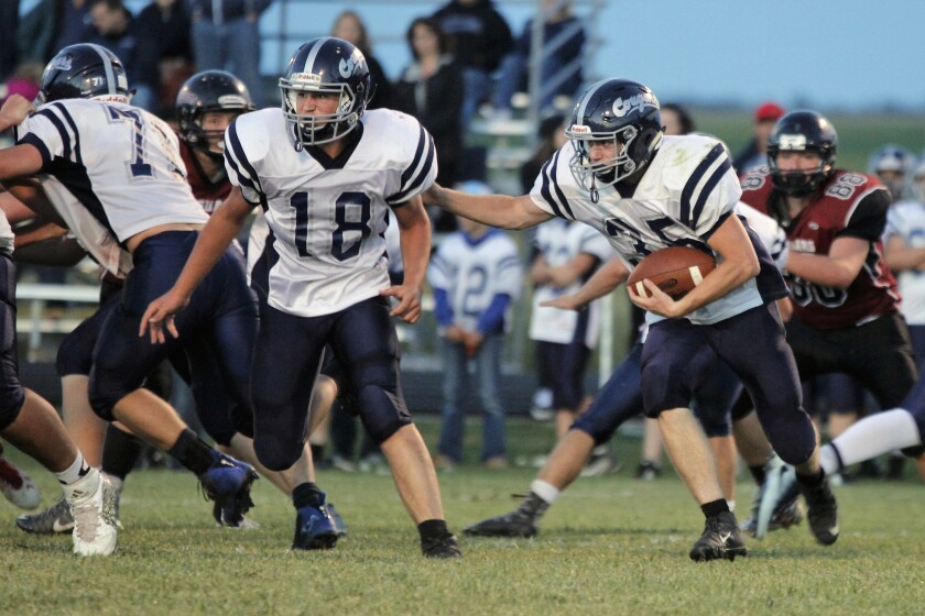 Burke/South Central's Vladik Johnson, right, gets a block from teammate Joseph Reiser (18) on Friday in Corsica. (Ryan Deal/Republic)
