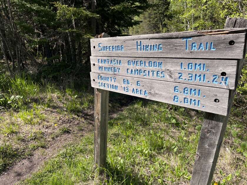 Superior Hiking Trail sign showing distances to various sites