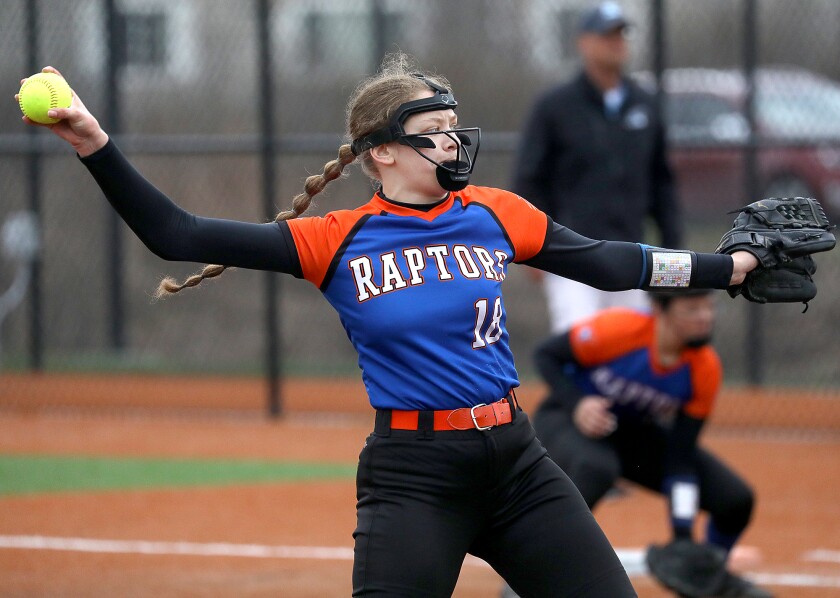 Carlton-Wrenshall’s Abby Mitchell (18) fires a pitch