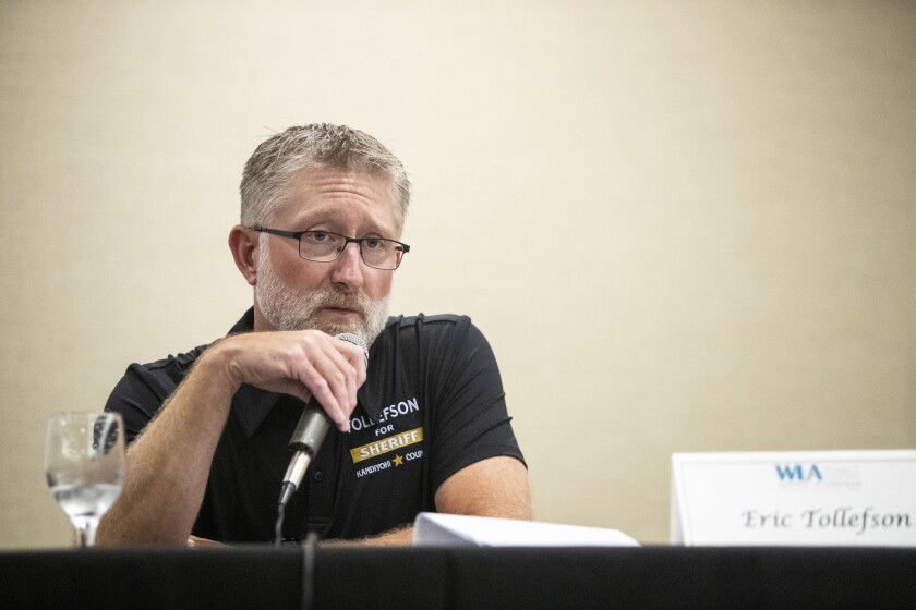Candidate for Kandiyohi County Sheriff Eric Tollefson answers a question while taking part in Friday's candidate forum at at the Willmar Convention Center.