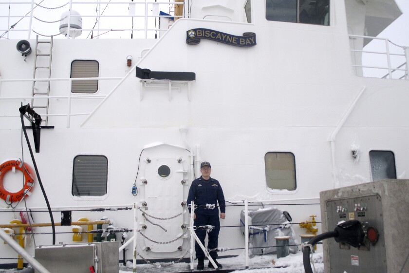 Lt. Alexander Stewart stands onboard the Biscayne Bay