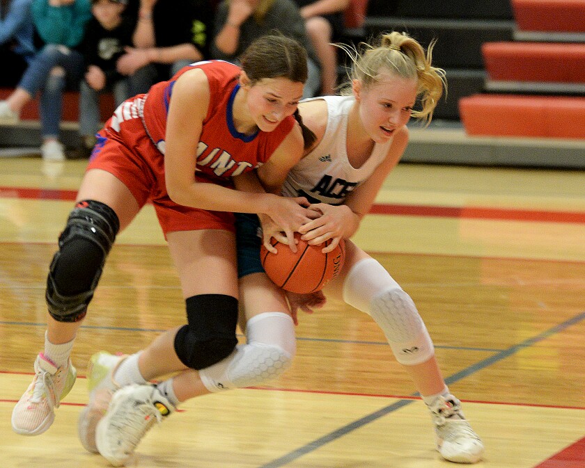 KMS sophomore Madelyn Luft, left, and ACGC freshman Ruby Klinger fight for control of the ball during a non-conference game on Tuesday, Nov. 29, 2022 at Kerkhoven.