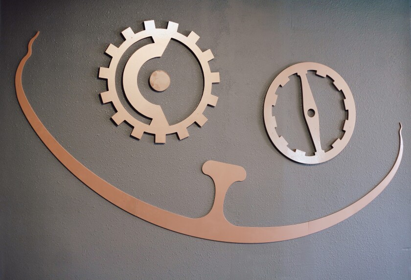 A close up of a metal sign in the shape of a cats face, May 20, 2022.