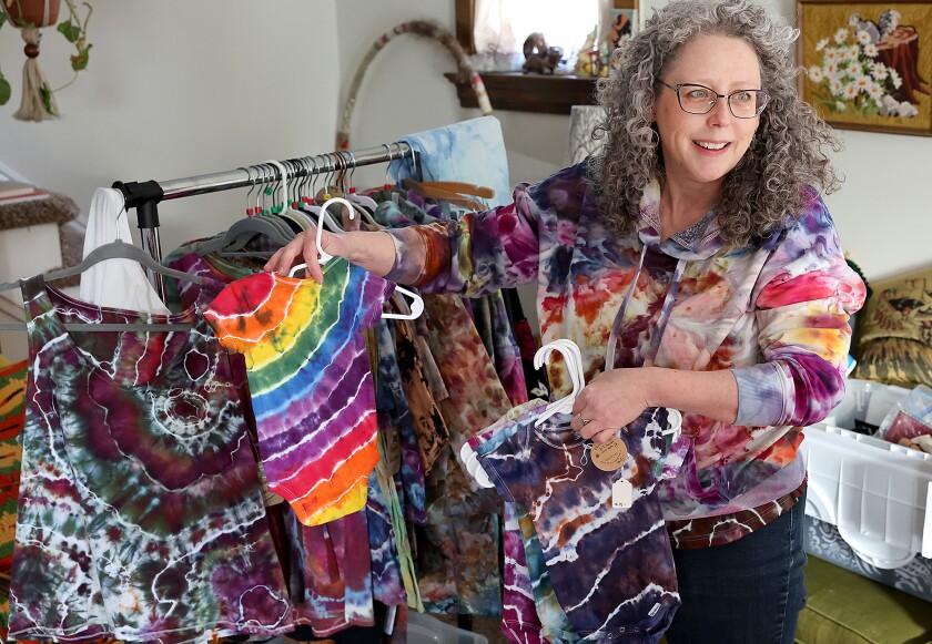 Woman shows pieces.