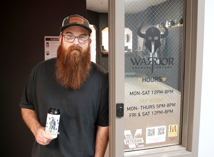 Ben Gipson, co-owner and Head Brewer at Warrior Brewing Company, stands in the doorway of the brewery at 2711 West Superior Street in Duluth