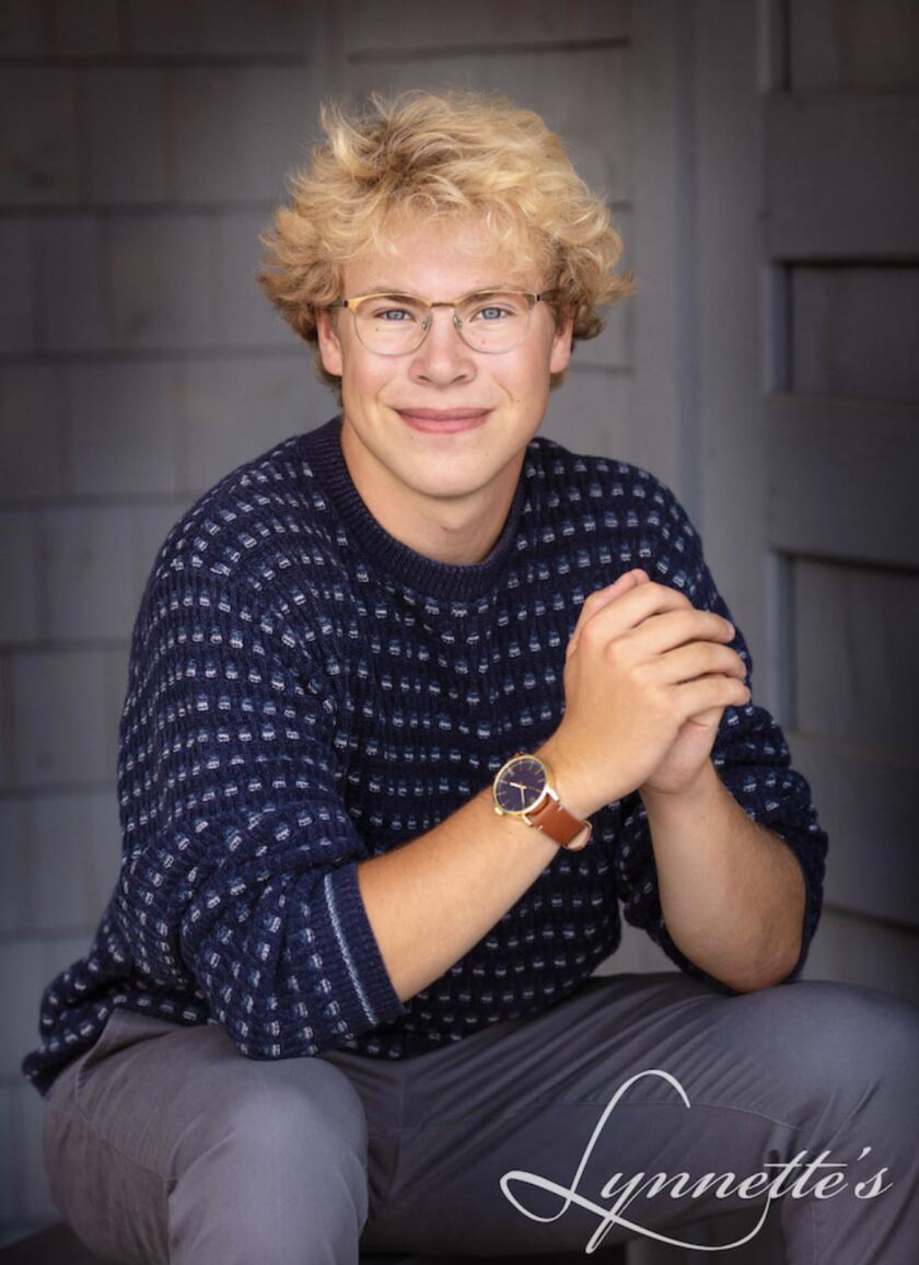 Christopher Kirby smiles for a senior photo