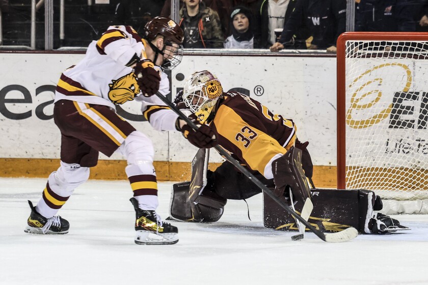 college men play ice hockey