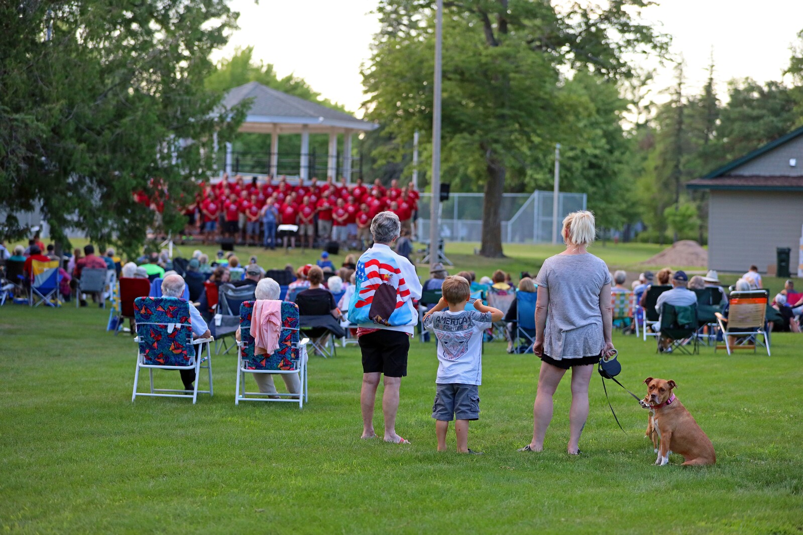 People enjoy a concert in the park