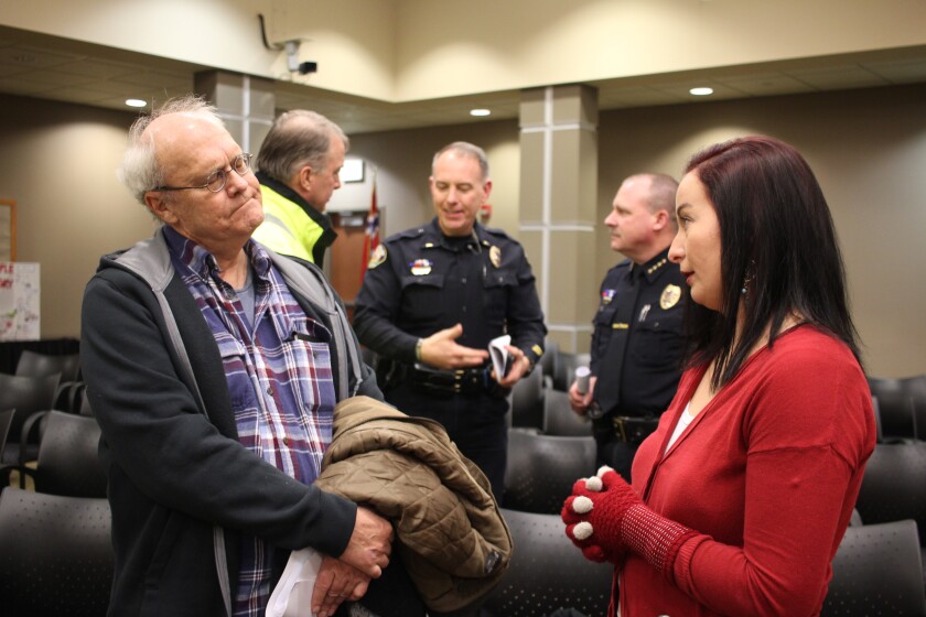 Whitney Fear, right, nursing case manager and visiting nurse at Family HealthCare, speaks with community member Harlan Sylvester after Thursday's meeting. Fear was one of six panellists during the evening's discussion. Kim Hyatt / Forums