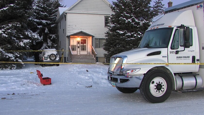 Fargo police truck sits in front of an apartment house