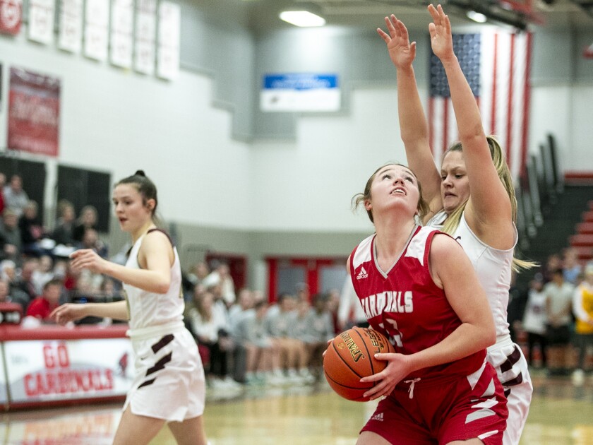 Willmar senior Ella Shinn works her way into the paint for a layup as the Cardinals played host to the Fergus Falls Otters Feb. 17, 2022.