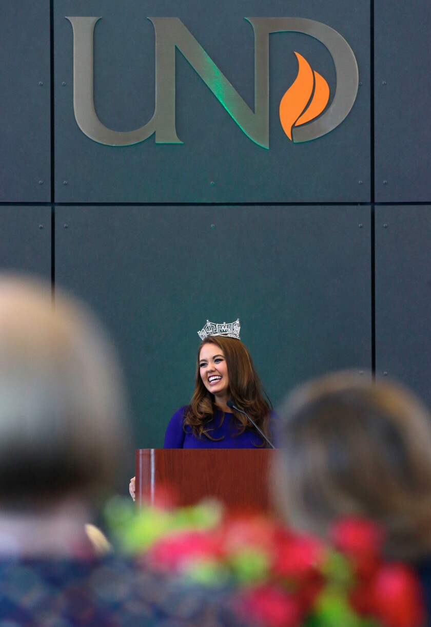 Miss America, Cara Mund of Bismarck, shares a laugh during the annual Women for Philanthropy luncheon hosted by the UND Alumni Foundation at the Gorecki Alumni Center Tuesday. photo by Eric Hylden/Grand Forks Herald