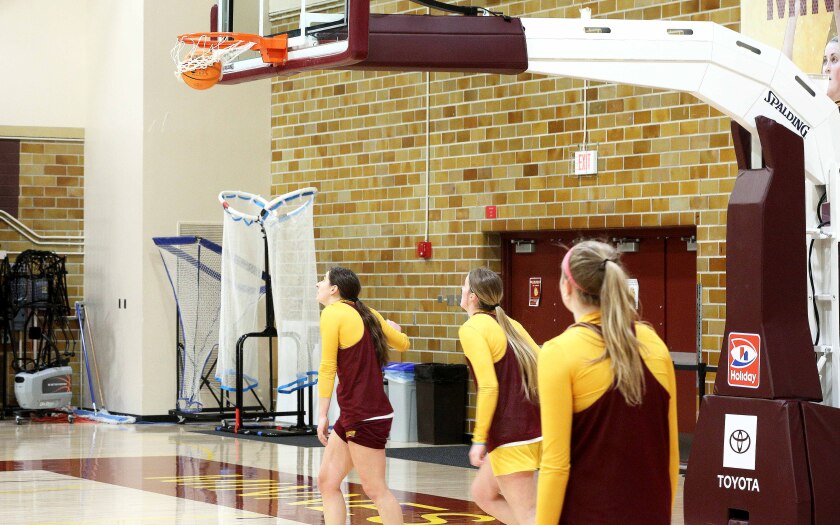 Basketball going through the net during a practice for the UMD womens team.