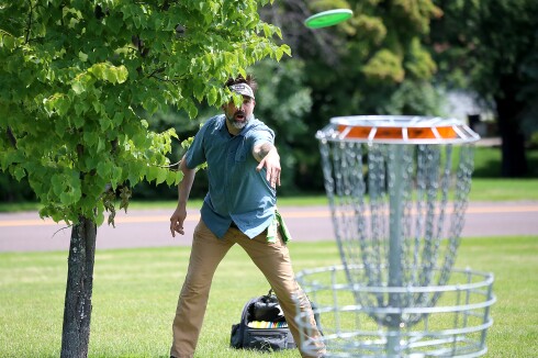 Player throws disc.