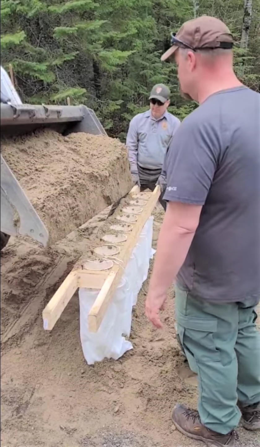 Voyageurs Park crew filling sandbags