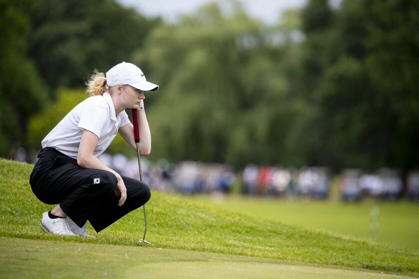 Benson golfer Alissa Maurer eyes a putt while playing in the Class A girls golf tournament at Pebble Creek Golf Club in Becker on Wednesday, June 15, 2022.