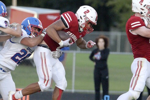 Willmar junior Ramero Trevino, 2, fights for extra yards during a North Central White District game against St. Cloud Apollo on Friday, Sept. 2, 2022 at Hodapp Field in Willmar.