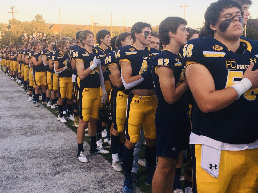 Scots line up from goal-line to goal-line for the national anthem.