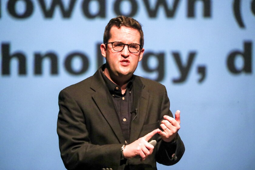 Dr. Jesse Keenan, a member of the faculty of the Graduate School of Design at Harvard, speaks about climate change adaptation at Marshall Performing Arts Center on the University of Minnesota Duluth campus Wednesday. Clint Austin / caustin@duluthnews.com