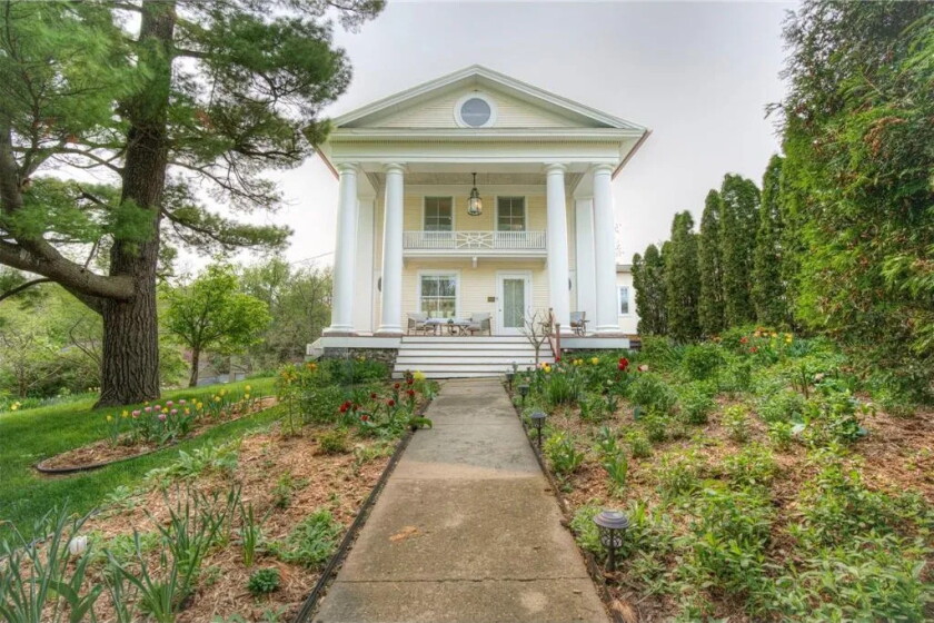 A historic Neoclassical home sits in the treetops of Rochester's Pill ...
