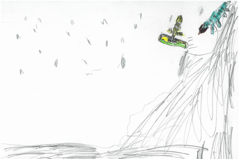 A snowboarder going over a jump on a hill.