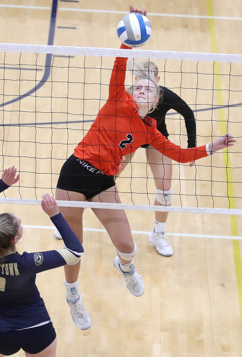 Grand Rapids’ Colby LaPlant (2) knocks down an overpass in the second game of the match in Hermantown
