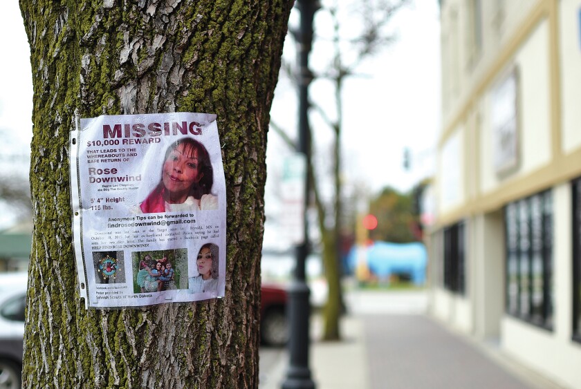 A poster offering a reward for leads to the whereabouts of Rose Downwind is stapled to a tree on Third Street Northwest in downtown Bemidji in November 2015. (Jillian Gandsey | Bemidji Pioneer)