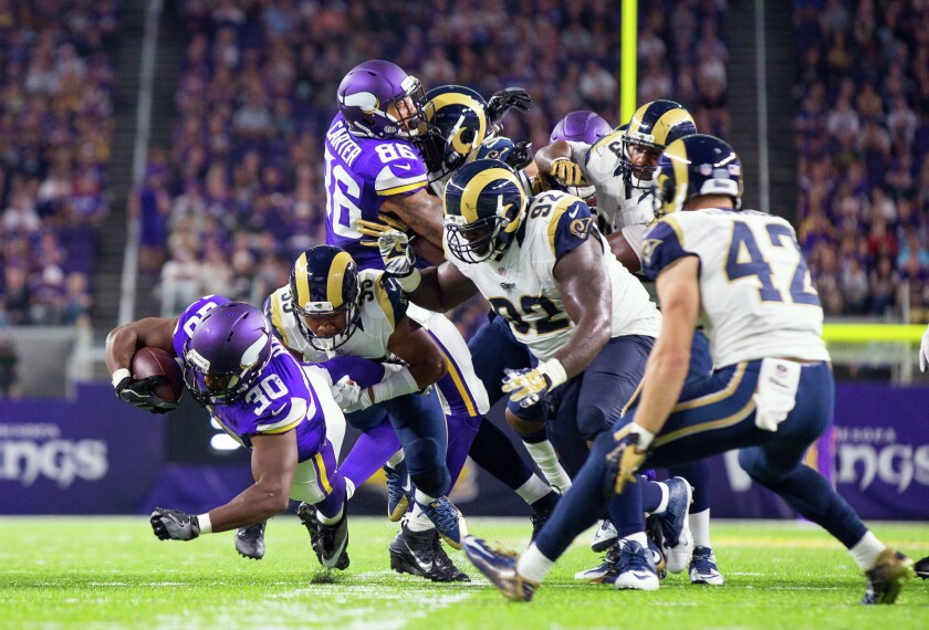 Minnesota Vikings running back C.J. Ham (30) runs in the second quarter against the Los Angeles Rams at U.S. Bank Stadium on Thursday night. Ham is a former Augustana University in Sioux Falls player. Photo by Brad Rempel-USA TODAY Sports