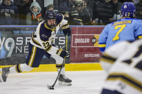 high school boys play ice hockey