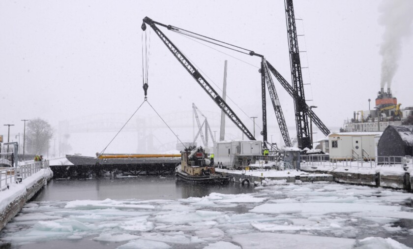 Dewatering bulkheads are removed from the MacArthur Lock in Sault Ste. Marie, Mich., during maintenance work earlier this month. The MacArthur smaller than the larger Poe Lock, which handles most Great Lakes freighter traffic to and from Lake Superior, and closes for the season Monday. (U.S. Army Corps of Engineers photo)
