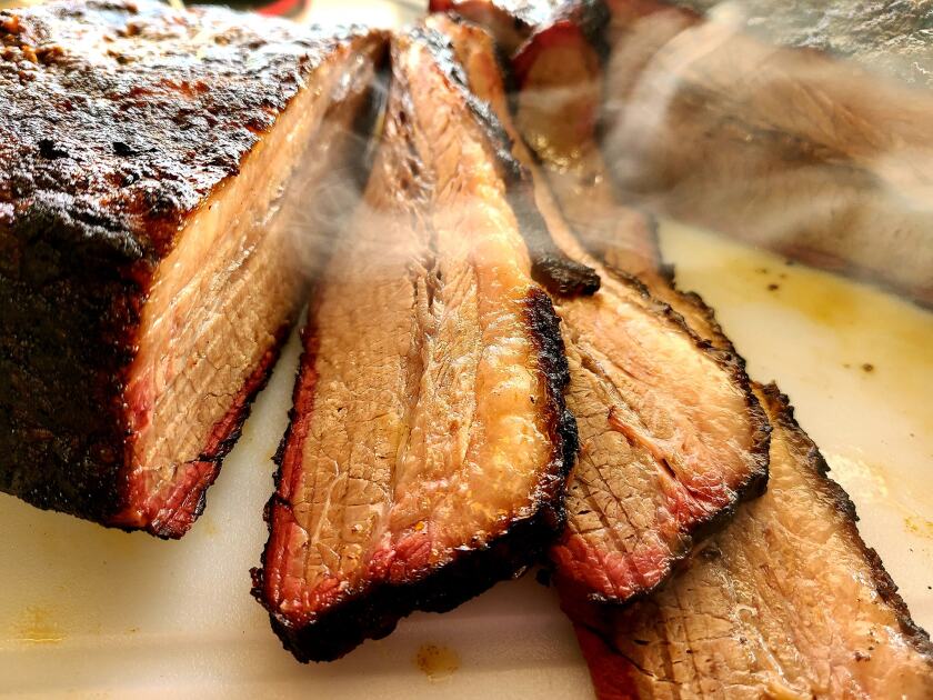 Smoked brisket from The Grub Tub is shown.