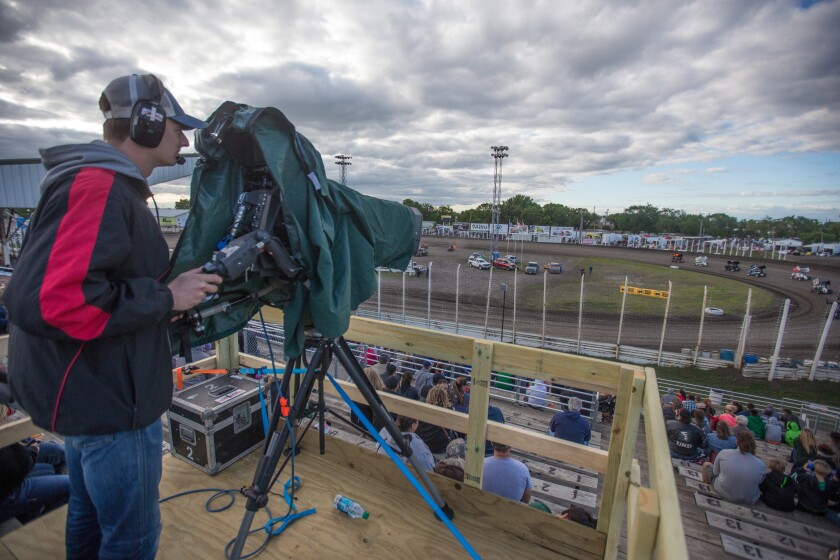 Marty Mueller, a cameraman for Midco sports, tracks the lightning sprints during a heat race at the River Cities Speedway on Friday, June 23, 2017. (Joshua Komer / Forum News Service)