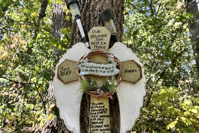 A memorial dedicated to the life of Refugio Rodriguez now hangs on a tree along the walking path where his body was discovered in September of 2020.