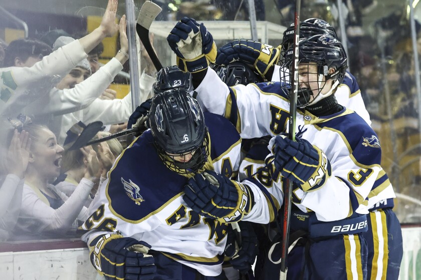 high school boys play ice hockey