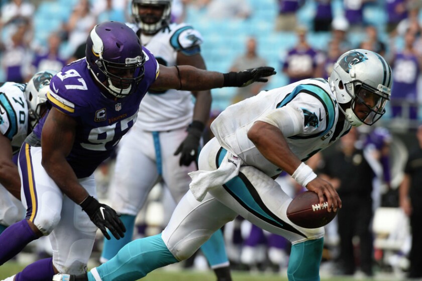 Carolina Panthers quarterback Cam Newton (1) is sacked by Minnesota Vikings defensive end Everson Griffen (97) in the fourth quarter. The Vikings defeated the Panthers 22-10 at Bank of America Stadium. Photo by Bob Donnan-USA TODAY Sports