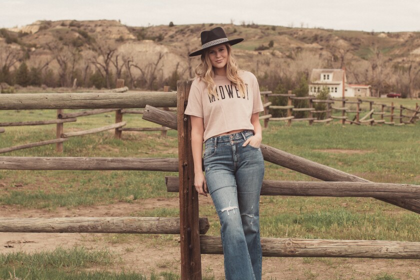 Taylor Roney models an outfit, carried by the Medora store JQ Clothing.