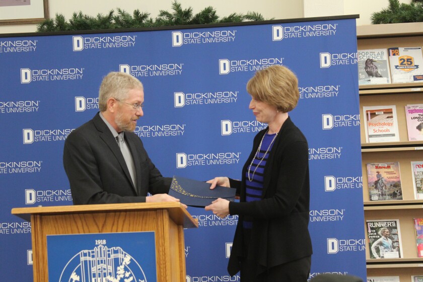 Dickinson State University president Tom Mitzel introduces Sharon Kilzer, project manager for the Theodore Roosevelt Center. Iain Woessner / Forum News Service
