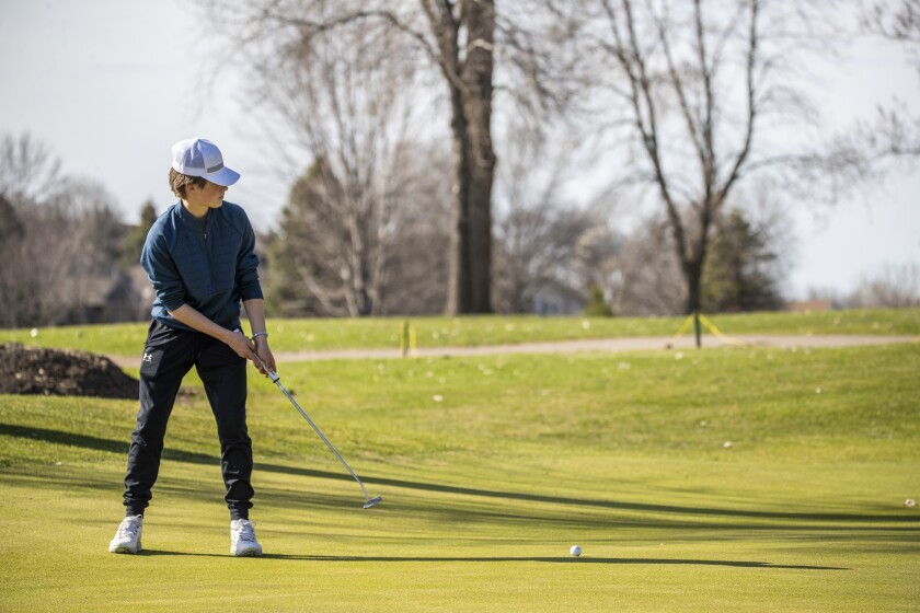 Carver Vanderhagen of Central Minnesota Christian putts during a Camden Conference boys and girls golf meet at Valley Golf Course Thursday, May 5, 2022, in Willmar.