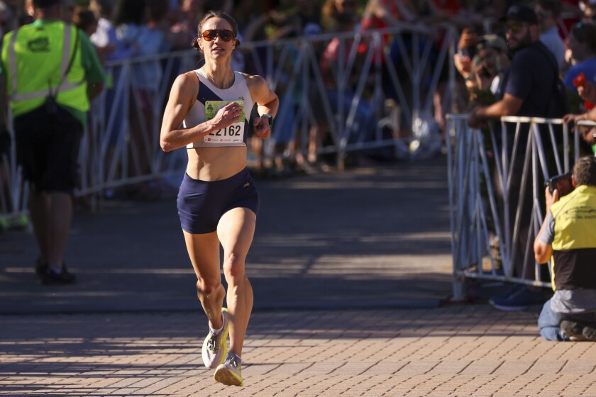 People running road race summer night