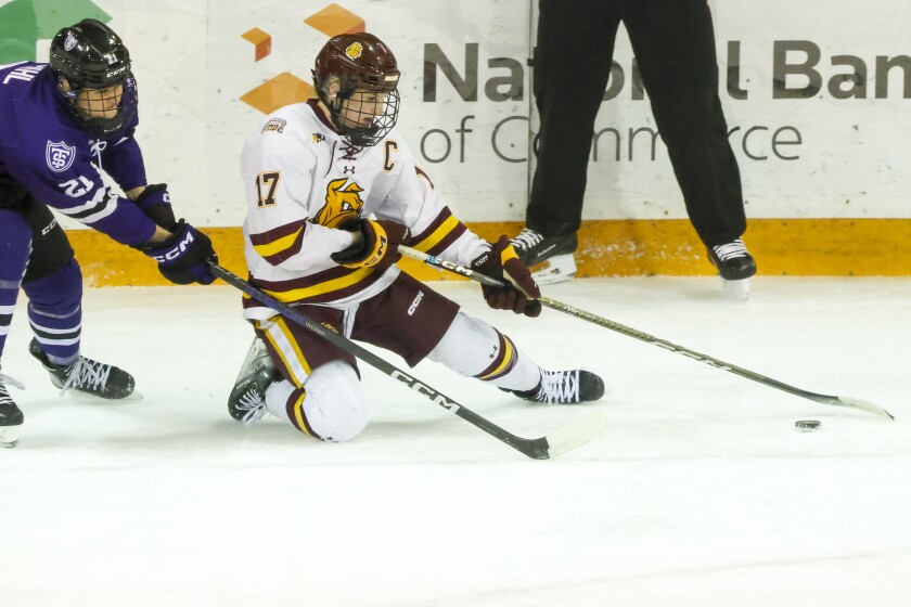 college women play hockey at arena