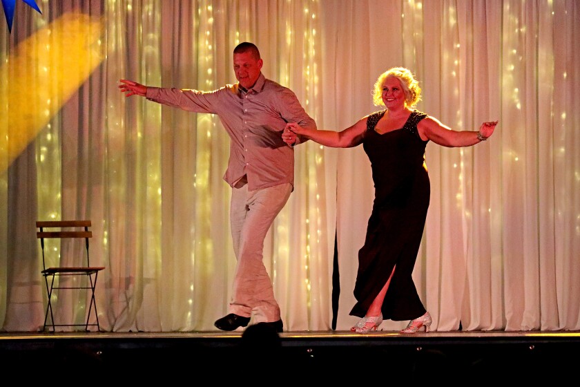 Dancer perform on stage.
