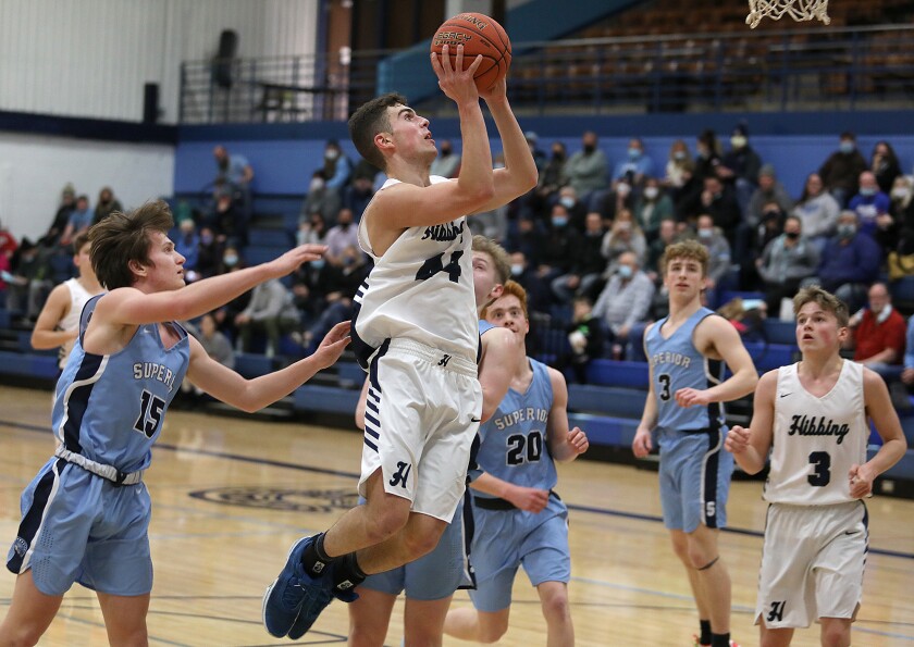 Hibbing’s Ayden McDonald (44) slips past the Spartan defense