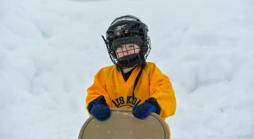 Aiden Reinersten, 5, of Esko, has fun pushing around a chair on the rink