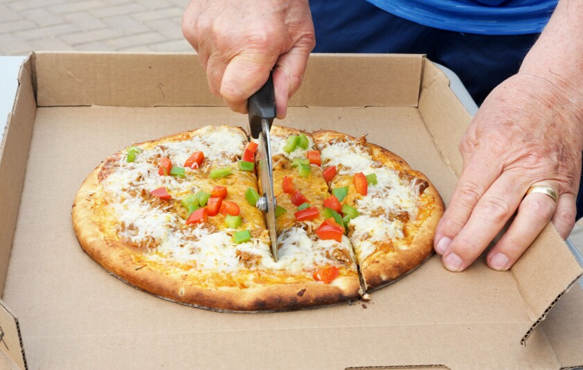 Cutting pizza
