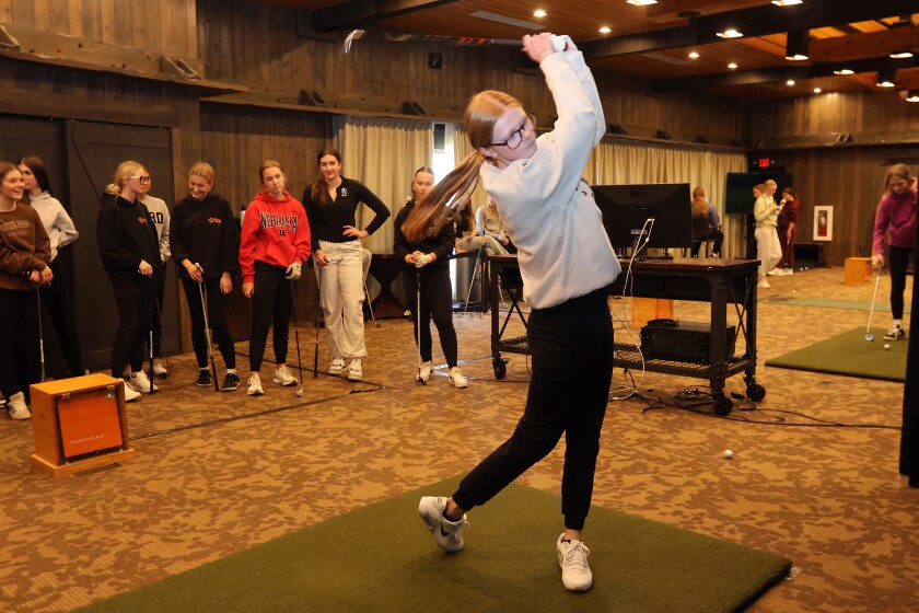 Libby Lake shows off her swing during the Brainerd Warriors golf practice on Wednesday, April 9, 2025, at Madden's Resort.