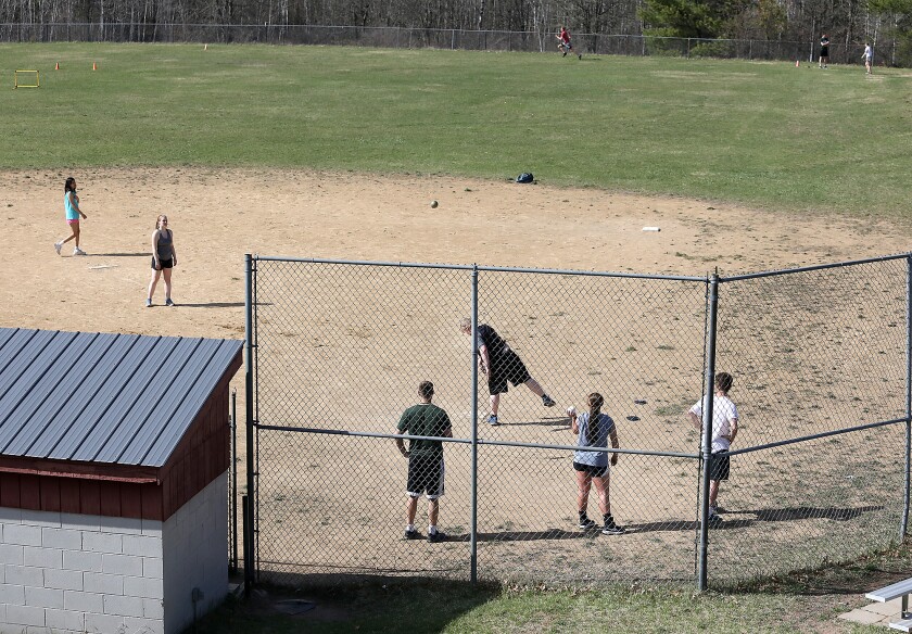 Northwood/Solon Springs’ Gavin Nelson throws the shot on the old softball field