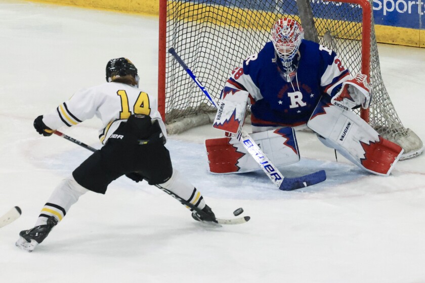 high school girls play ice hockey